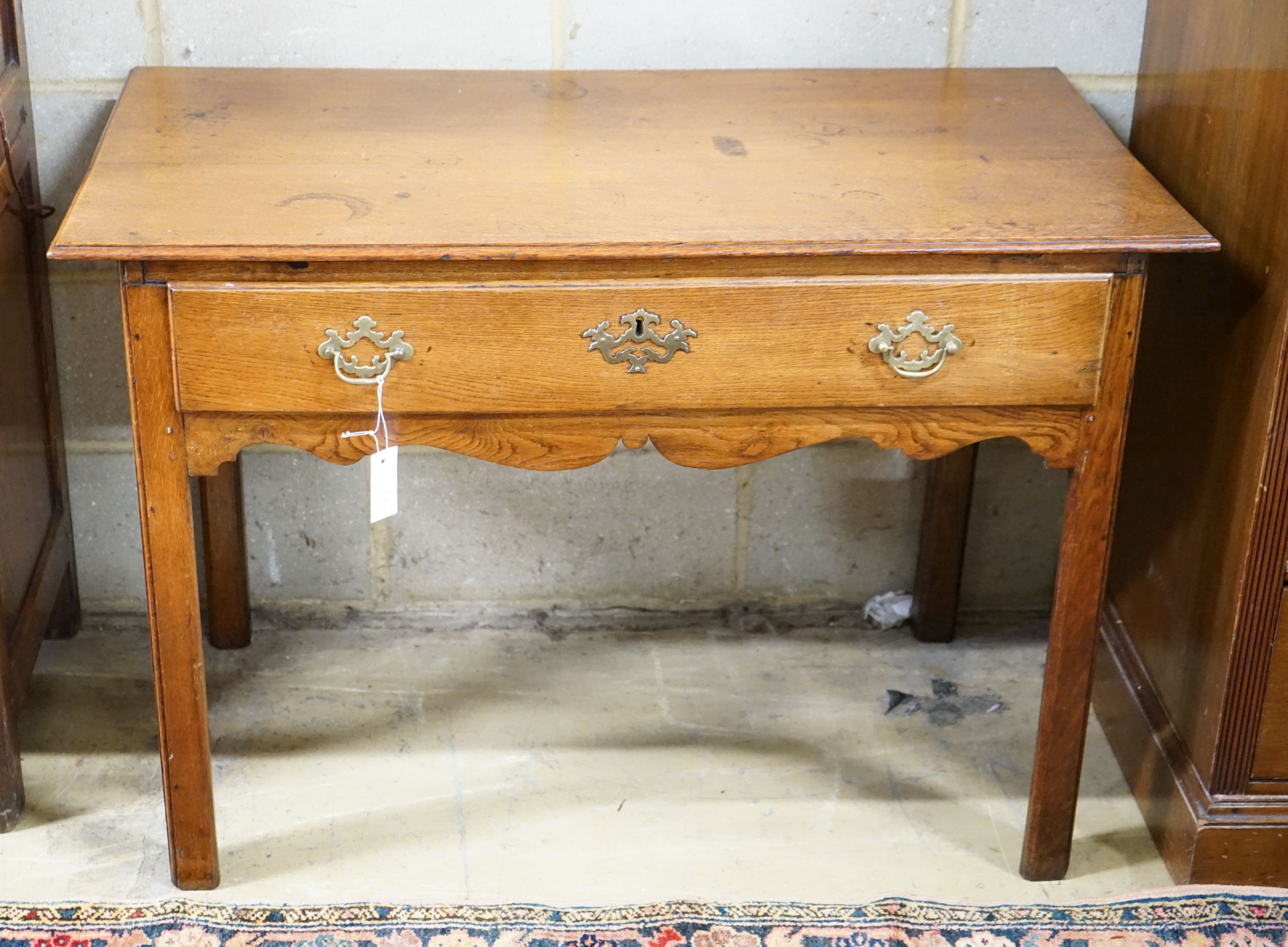 A George III oak side table, width 106cm, depth 57cm, height 72cm